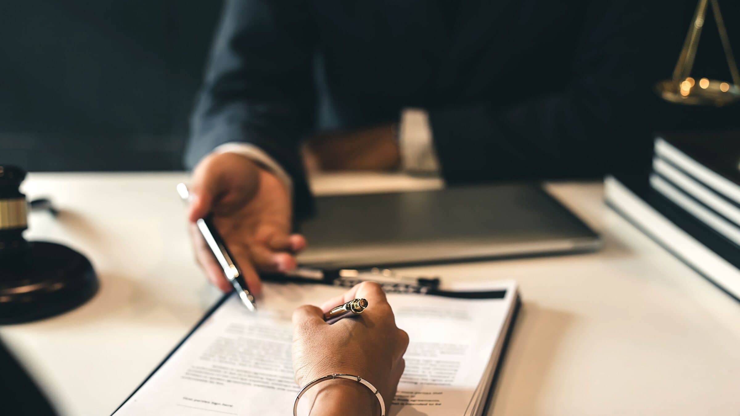 Two professionals reviewing an agreement together