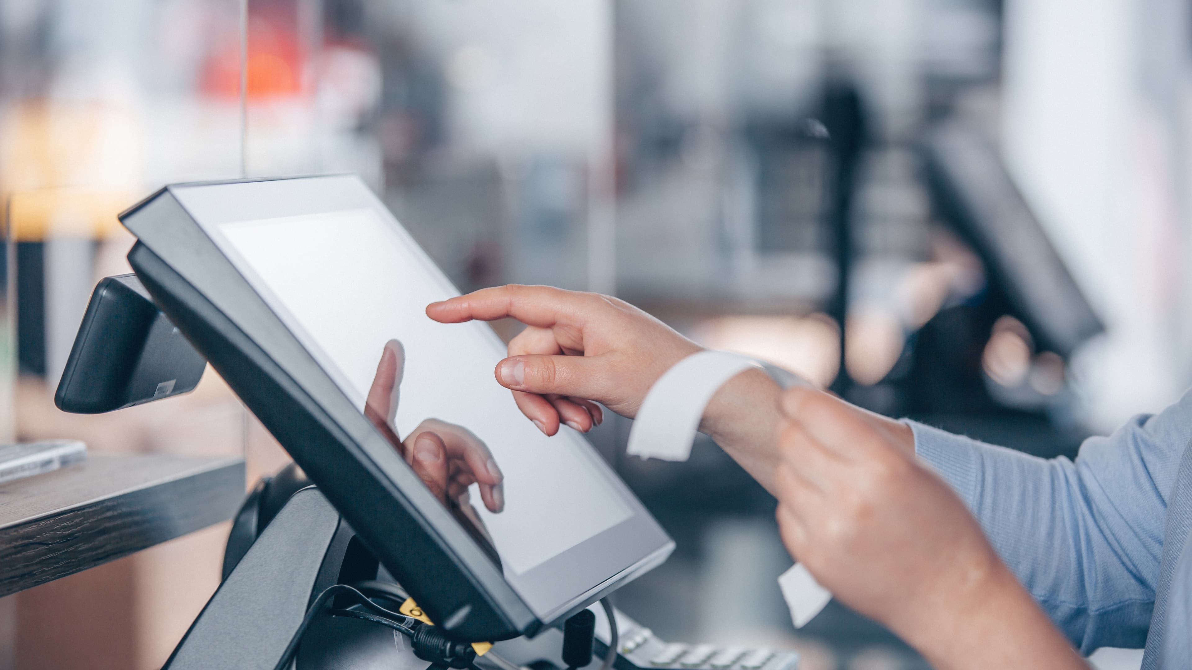 Merchant completing a sale at a point-of-sale touchscreen